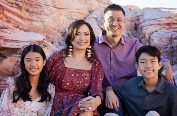 Family photo in front of desert rocks